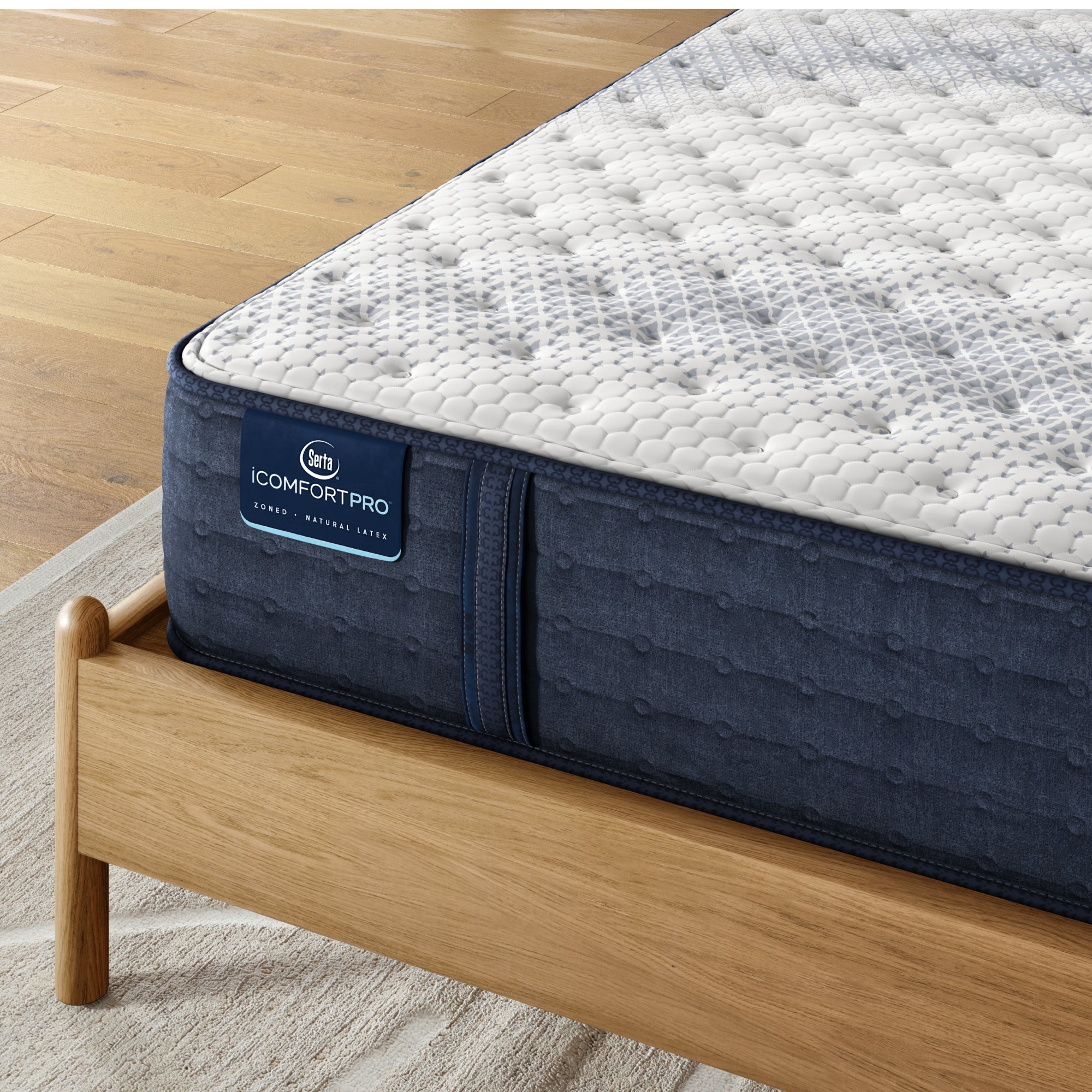 Close-up of firm iComfortPro Ambrose Serta Memory Foam mattress corner | Smooth fabric cover and detailed stitching