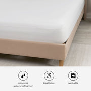 The corner of an iProtect mattress protector on a bed frame. 