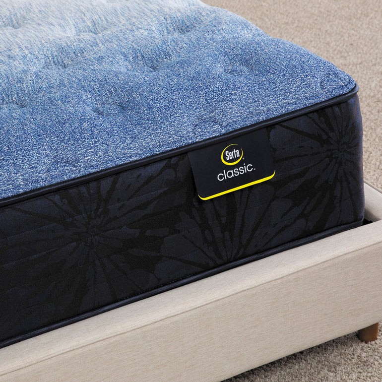 Close-up of Classic Brecon Medium Serta mattress corner | Breathable fabric cover and detailed stitching