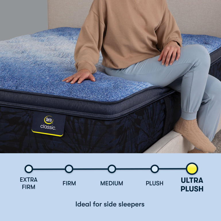 Person sitting on edge of plush Classic Brecon Plush Pillow Top Serta mattress | Ideal for side sleepers with plush firmness