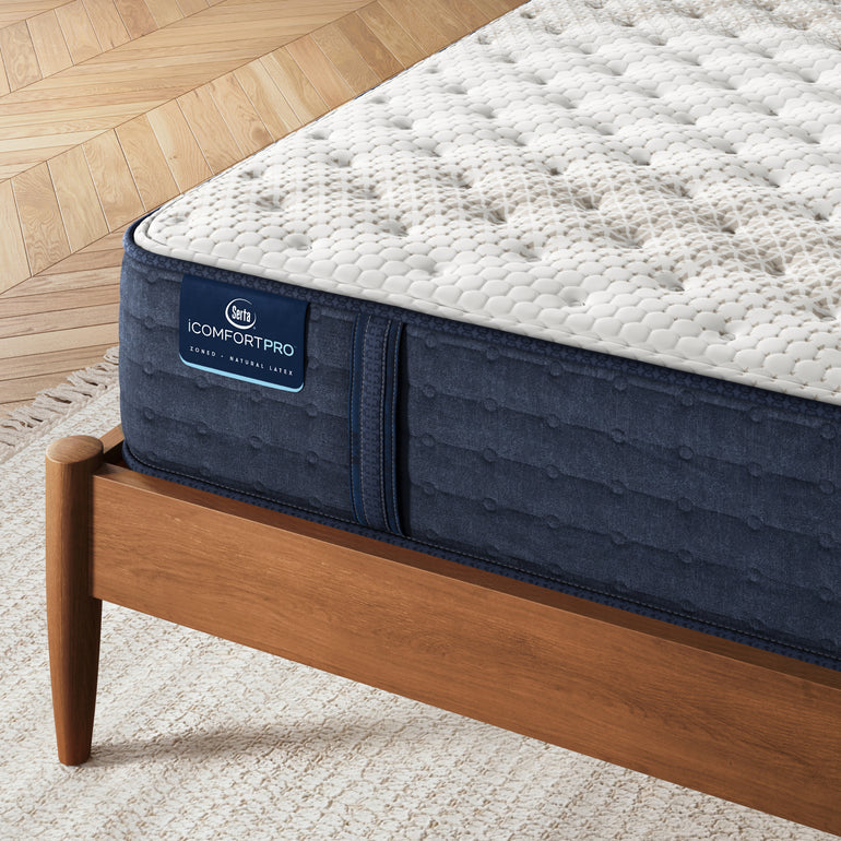 Close-up of iComfortPro Chelsea Medium Serta memory foam mattress corner | Smooth fabric cover and detailed stitching