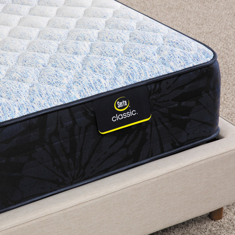 Close-up of Classic Dorian Firm Serta mattress corner | Breathable fabric cover and detailed stitching