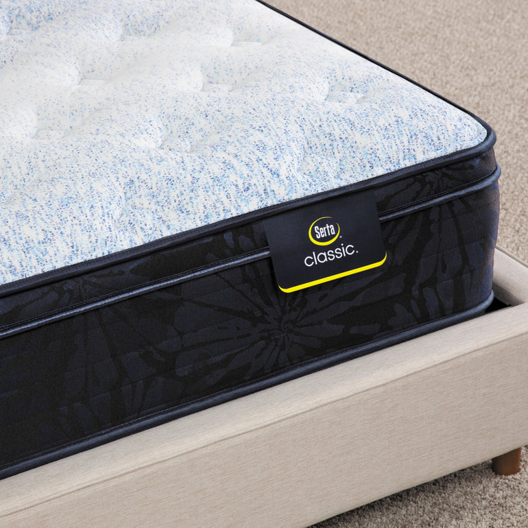 Close-up of Classic Dorian Plush Euro Top Serta mattress corner | Breathable fabric cover and detailed stitching