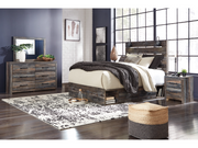Modern bedroom with wooden furniture, including a bed, dresser, and nightstands.