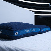 Two BEDGEAR Night Ice pillows on a mattress