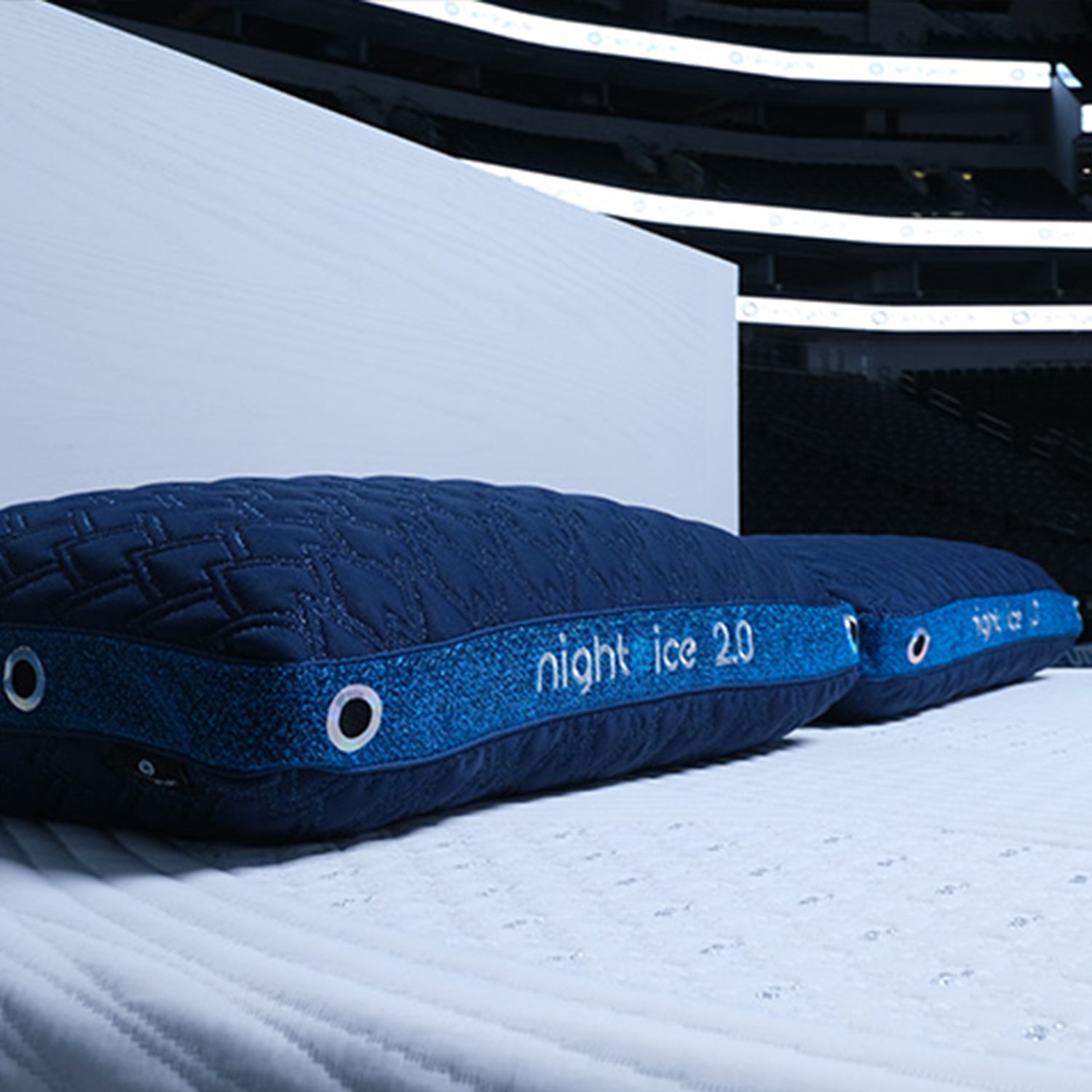 Two BEDGEAR Night Ice pillows on a mattress