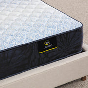 Close-up of the corner of a Classic Alden Medium Serta mattress corner | Breathable fabric cover and detailed stitching
