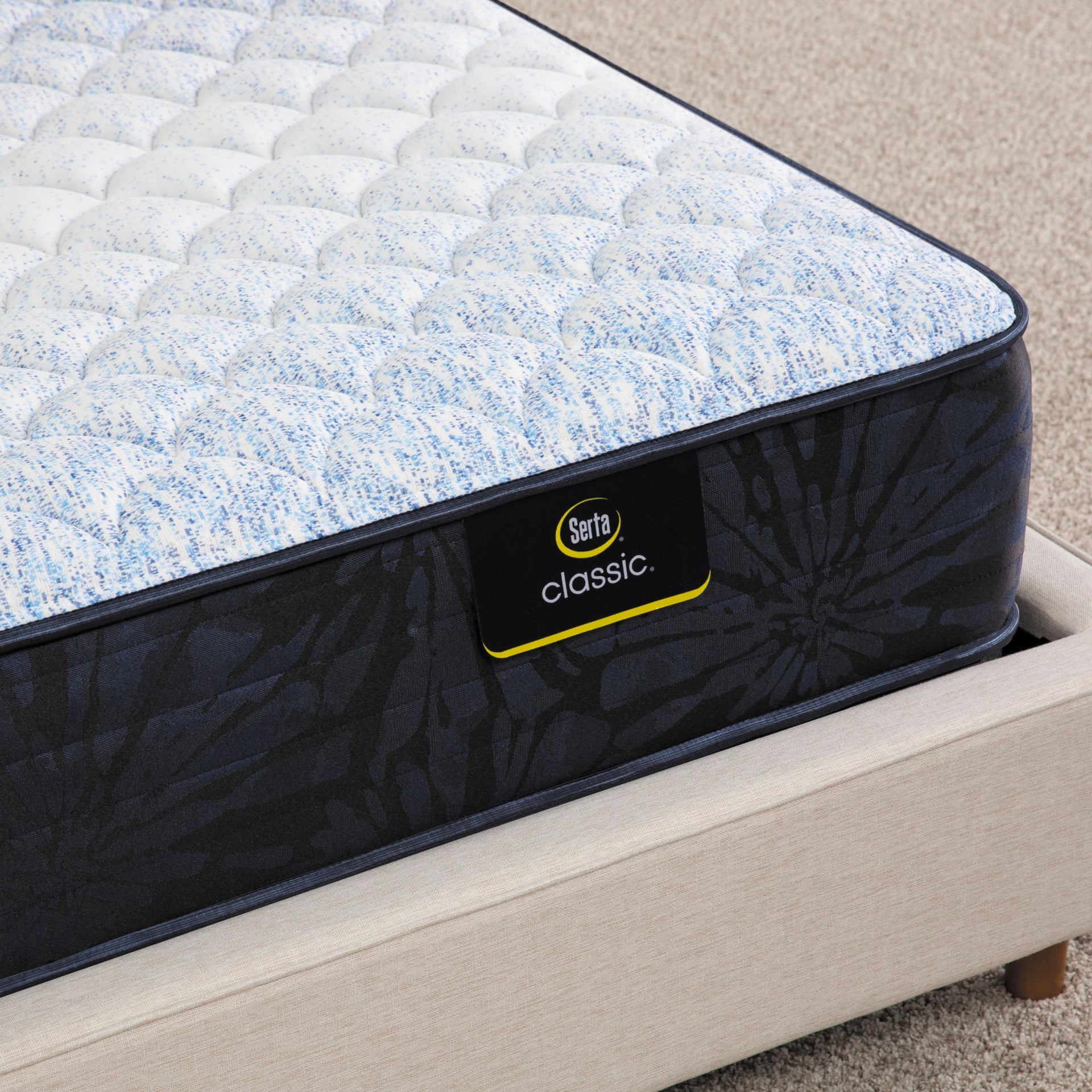 Close-up of the corner of a Classic Alden Medium Serta mattress corner | Breathable fabric cover and detailed stitching
